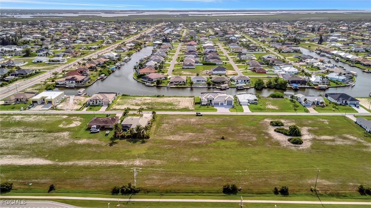 100 Burnt Store Road Cape Coral, FL 33993 - Photo 12 of 21 an aerial view of residential houses with outdoor space