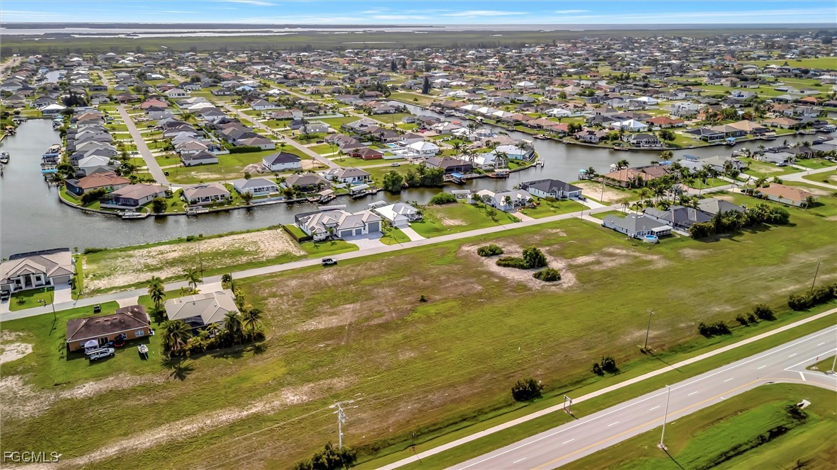 100 Burnt Store Road Cape Coral, FL 33993 - Photo 13 of 21 an aerial view of residential houses with outdoor space