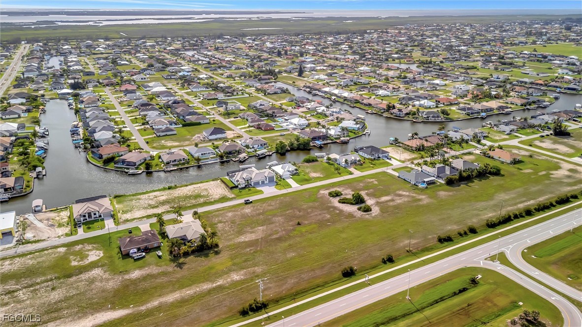 100 Burnt Store Road Cape Coral, FL 33993 - Photo 14 of 21 an aerial view of residential houses with outdoor space