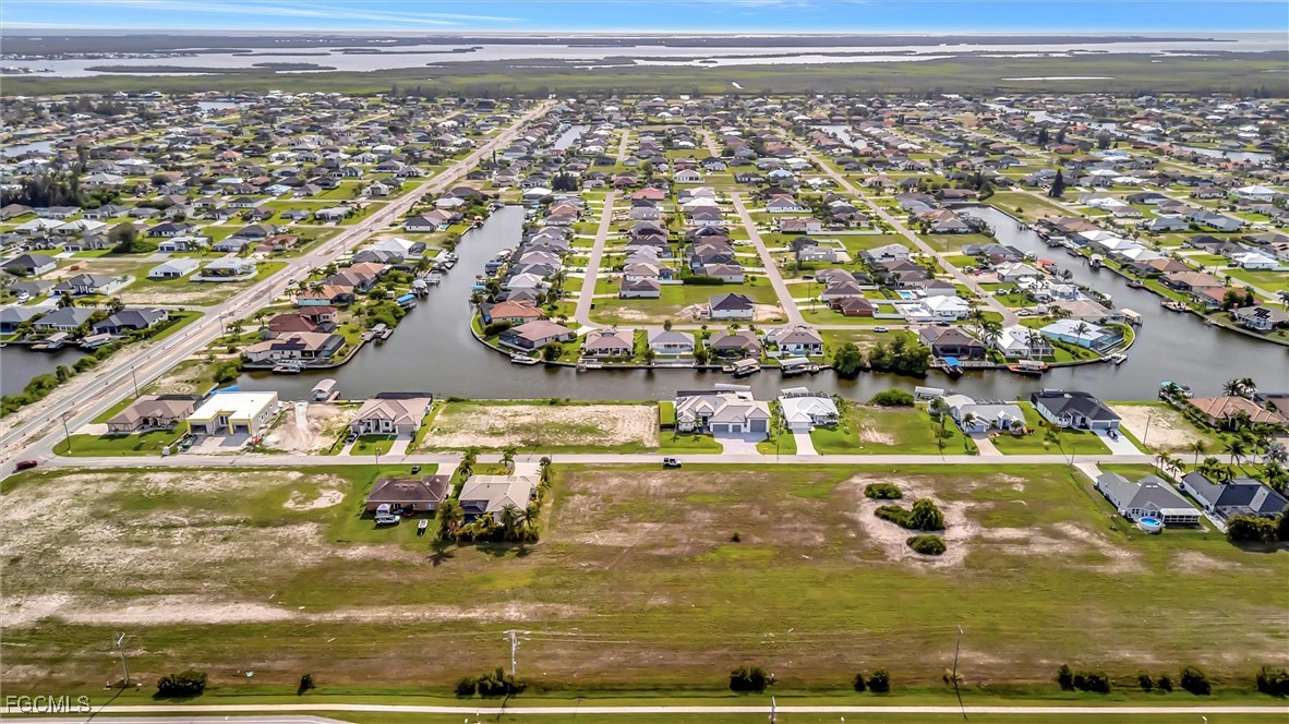 100 Burnt Store Road Cape Coral, FL 33993 - Photo 15 of 21 an aerial view of residential houses with outdoor space
