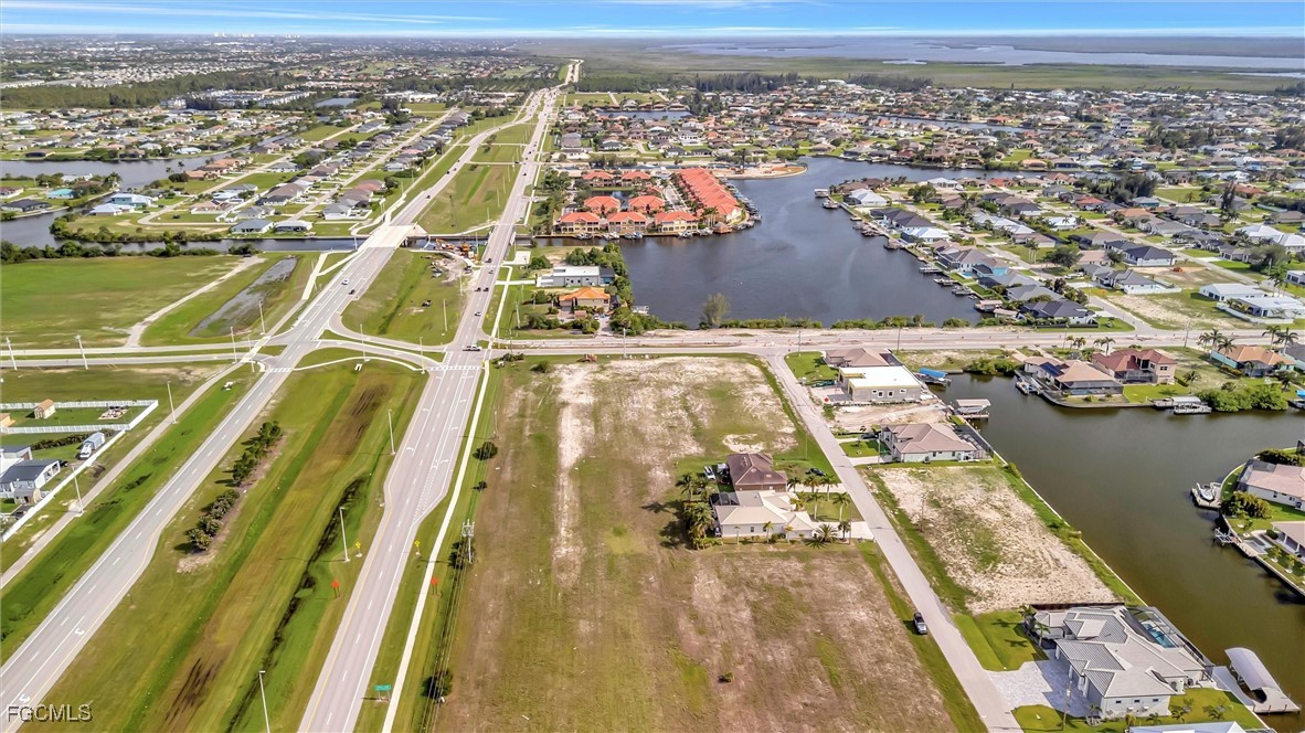 100 Burnt Store Road Cape Coral, FL 33993 - Photo 20 of 21 an aerial view of residential houses with outdoor space