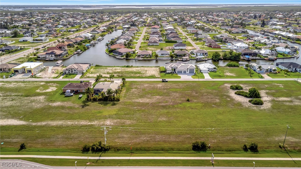 100 Burnt Store Road Cape Coral, FL 33993 - Photo 2 of 21 an aerial view of residential houses with outdoor space