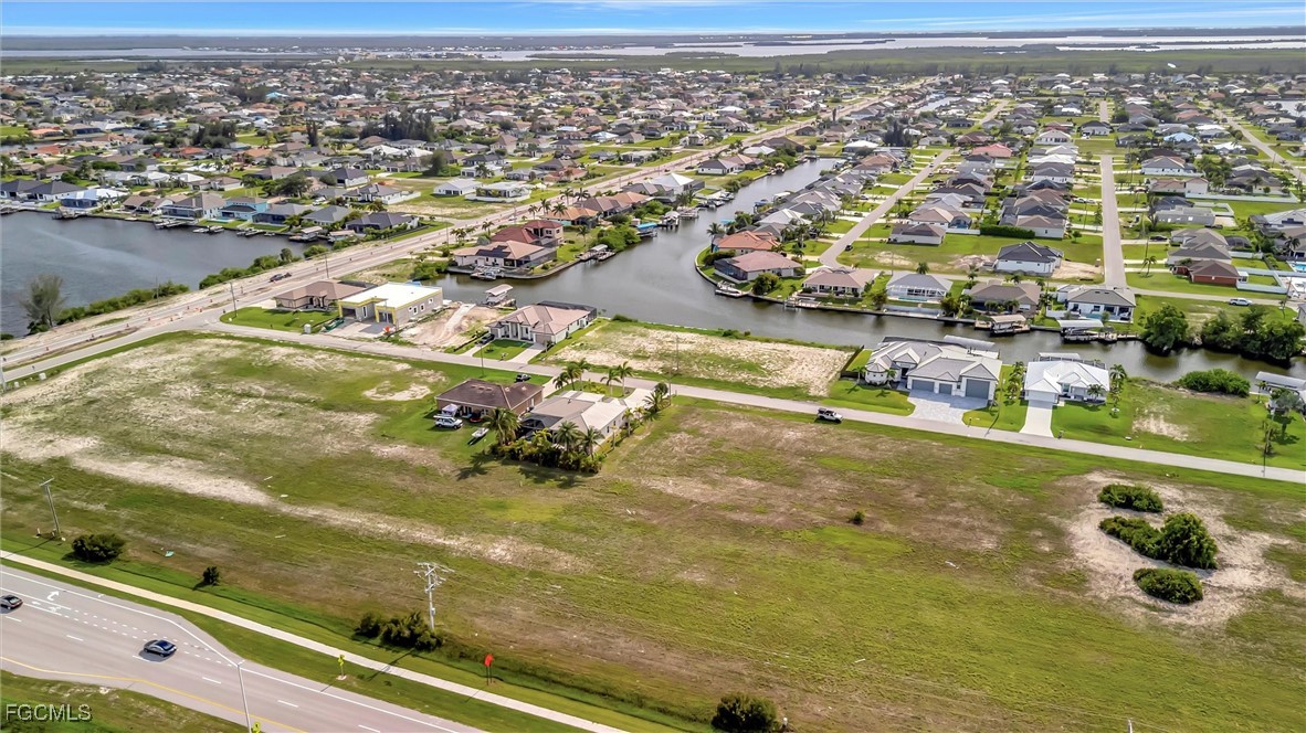 100 Burnt Store Road Cape Coral, FL 33993 - Photo 3 of 21 an aerial view of residential houses with outdoor space