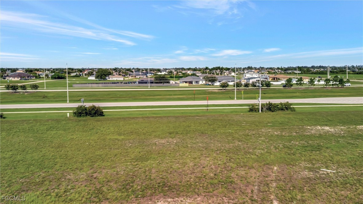 100 Burnt Store Road Cape Coral, FL 33993 - Photo 6 of 21 a view of building with outdoor space and seating