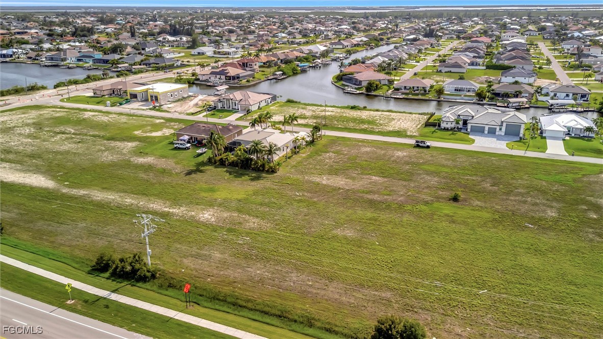 100 Burnt Store Road Cape Coral, FL 33993 - Photo 9 of 21 an aerial view of residential houses with outdoor space