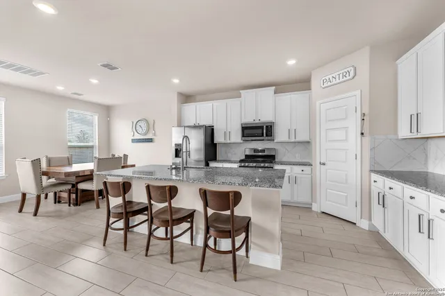 a large kitchen with cabinets