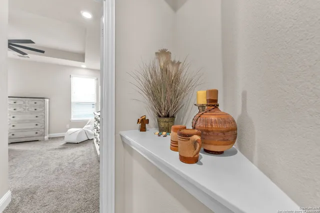 a vase of flowers sitting on a floor