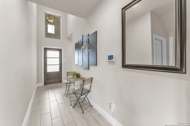 a workspace room with furniture and windows