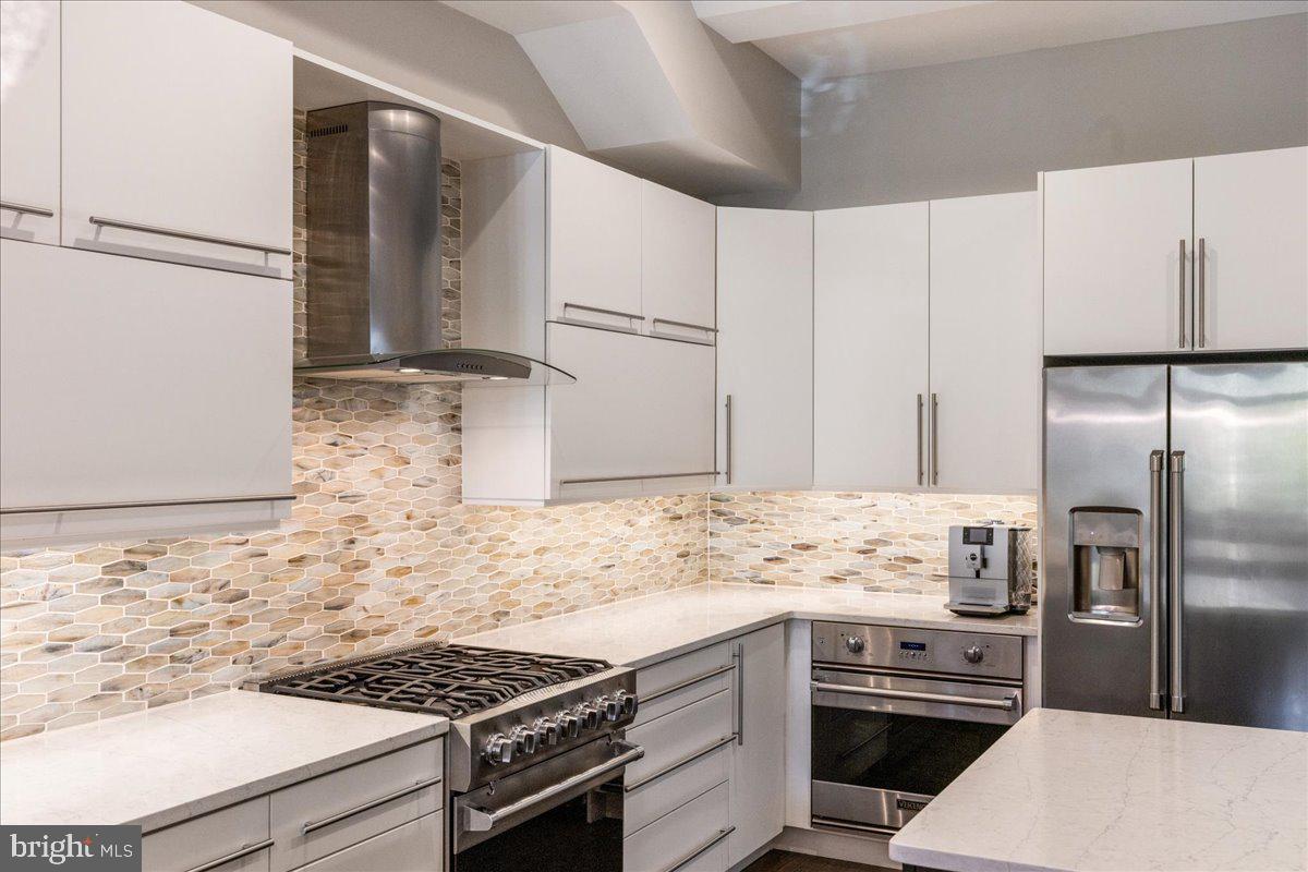 20 East Court Street Doylestown, PA 18901 - Photo 12 of 34 a kitchen with stainless steel appliances a refrigerator sink and stove