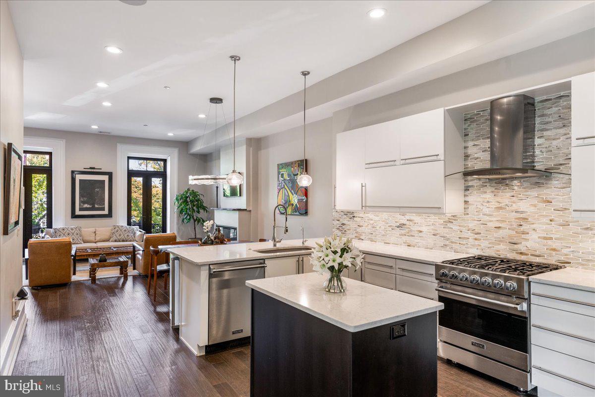 20 East Court Street Doylestown, PA 18901 - Photo 14 of 34 a open kitchen with stainless steel appliances granite countertop a sink stove and refrigerator