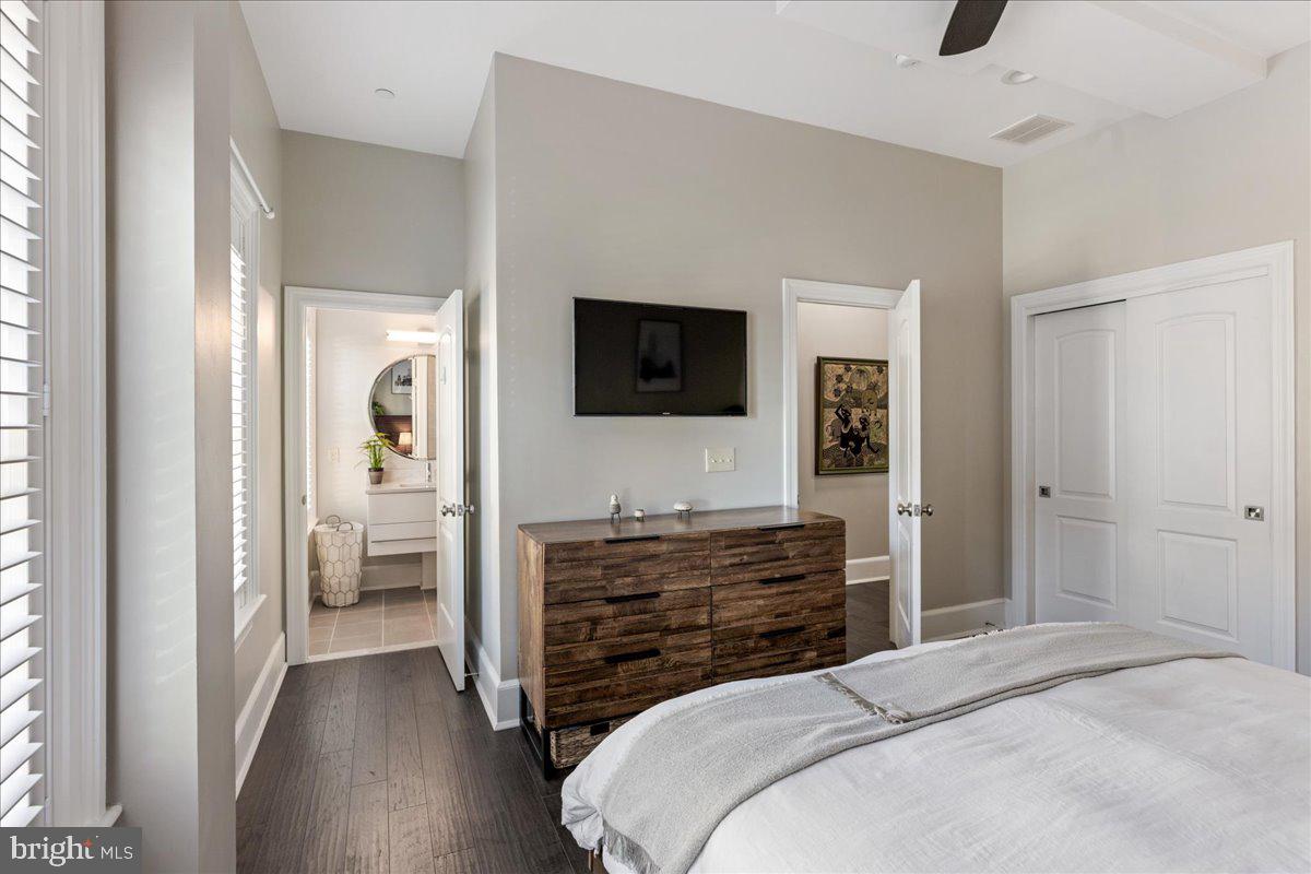 20 East Court Street Doylestown, PA 18901 - Photo 18 of 34 a bedroom with a bed and flat screen tv
