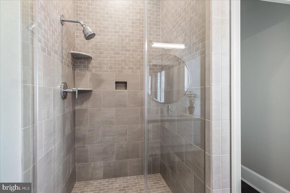 20 East Court Street Doylestown, PA 18901 - Photo 19 of 34 a bathroom with a shower