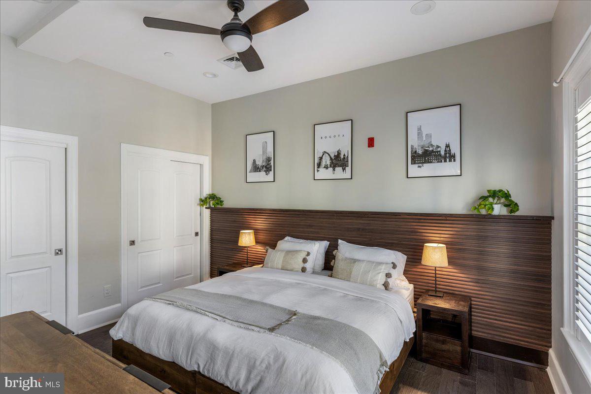 20 East Court Street Doylestown, PA 18901 - Photo 21 of 34 a bedroom with bed and paintings on the wall