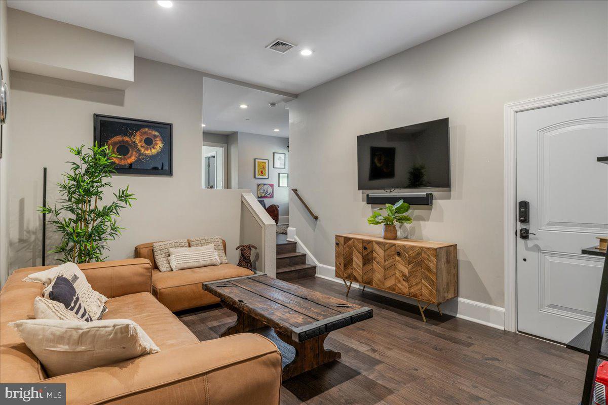 20 East Court Street Doylestown, PA 18901 - Photo 22 of 34 a living room with furniture and a flat screen tv