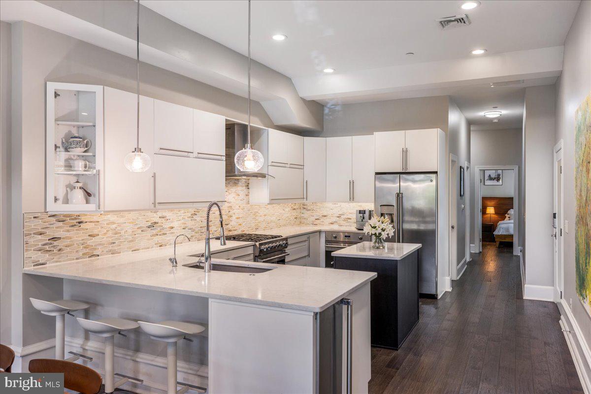 20 East Court Street Doylestown, PA 18901 - Photo 8 of 34 a kitchen with a sink a stove a refrigerator and cabinets