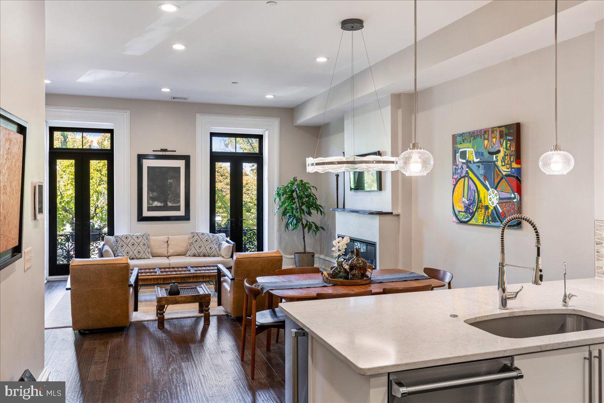 20 East Court Street Doylestown, PA 18901 - Photo 10 of 34 a kitchen with a sink a counter and chairs