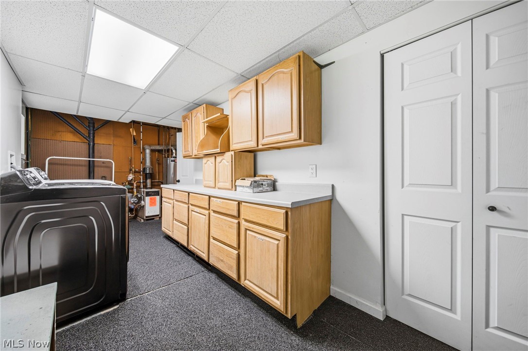 10397 Prouty Road Painesville, OH 44077 - Photo 24 of 32 Laundry room with a paneled ceiling, cabinet space, and washing machine and clothes dryer