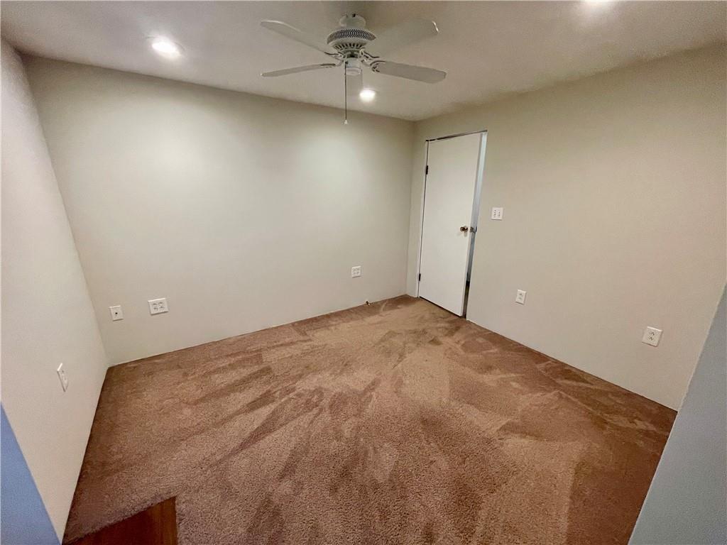 1121 School Road Apollo, PA 15613 - Photo 15 of 30 an empty room with a ceiling fan and window
