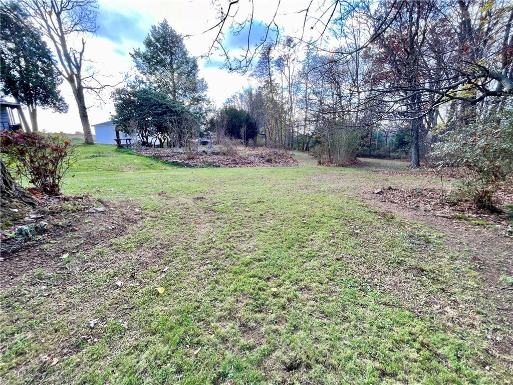 1121 School Road Apollo, PA 15613 - Photo 27 of 30 a view of a backyard with large trees