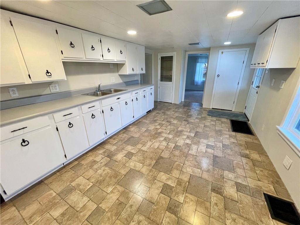 1121 School Road Apollo, PA 15613 - Photo 8 of 30 a large kitchen with cabinets