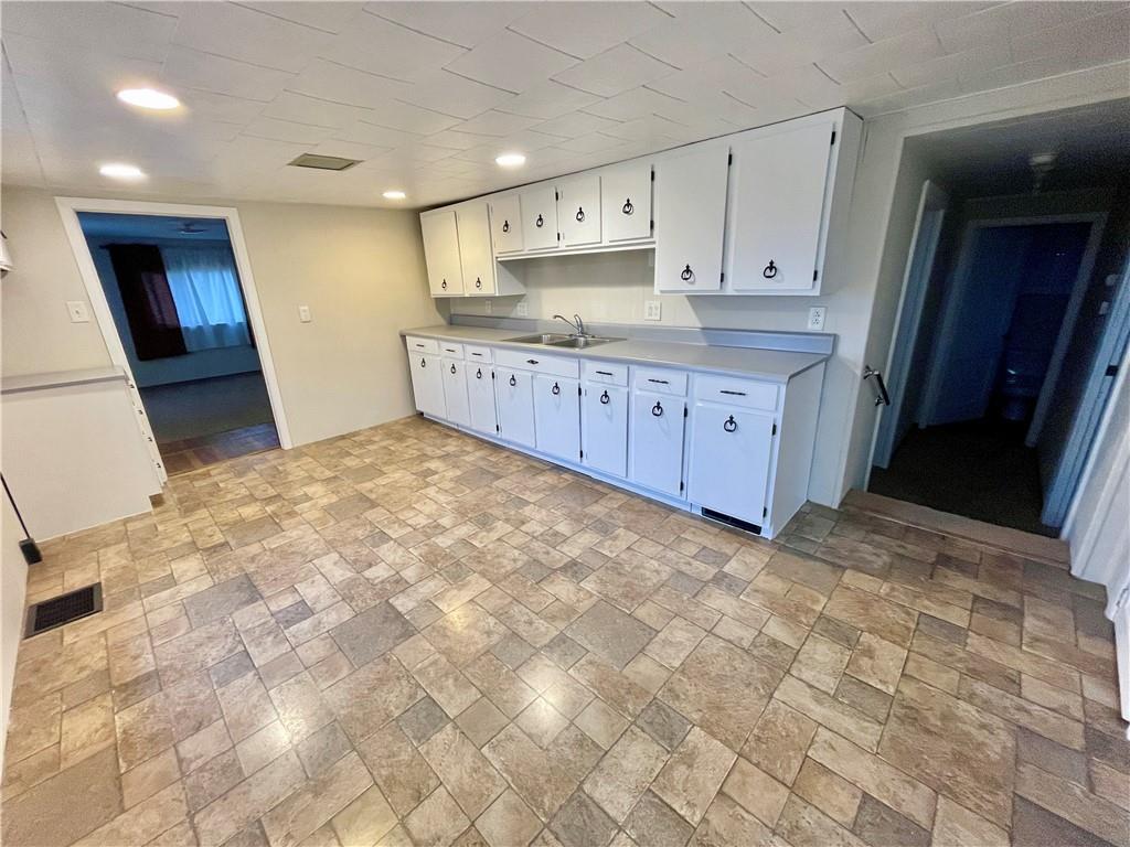 1121 School Road Apollo, PA 15613 - Photo 9 of 30 a large white kitchen with a sink
