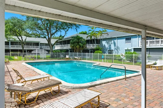 a view of swimming pool with a patio