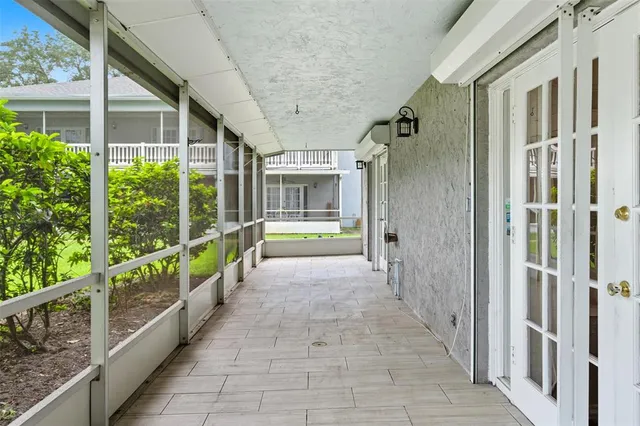 a view of a porch with a garden
