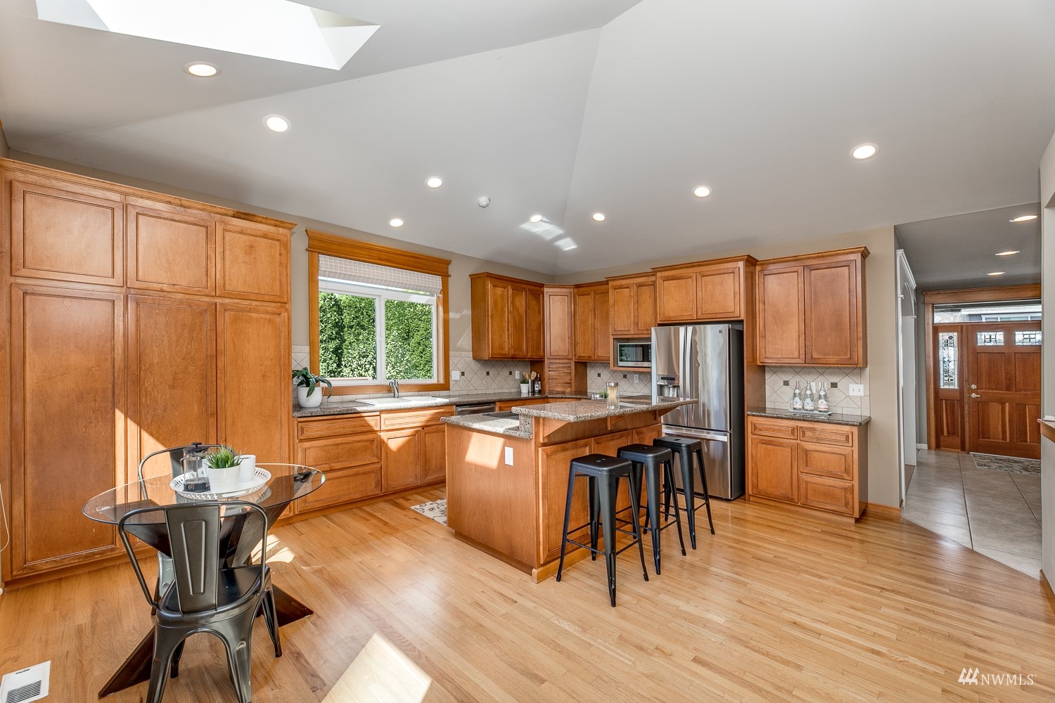 24222 23rd Avenue Southeast Bothell, WA 98021 - Photo 18 of 40 a kitchen with a table chairs and wooden floor