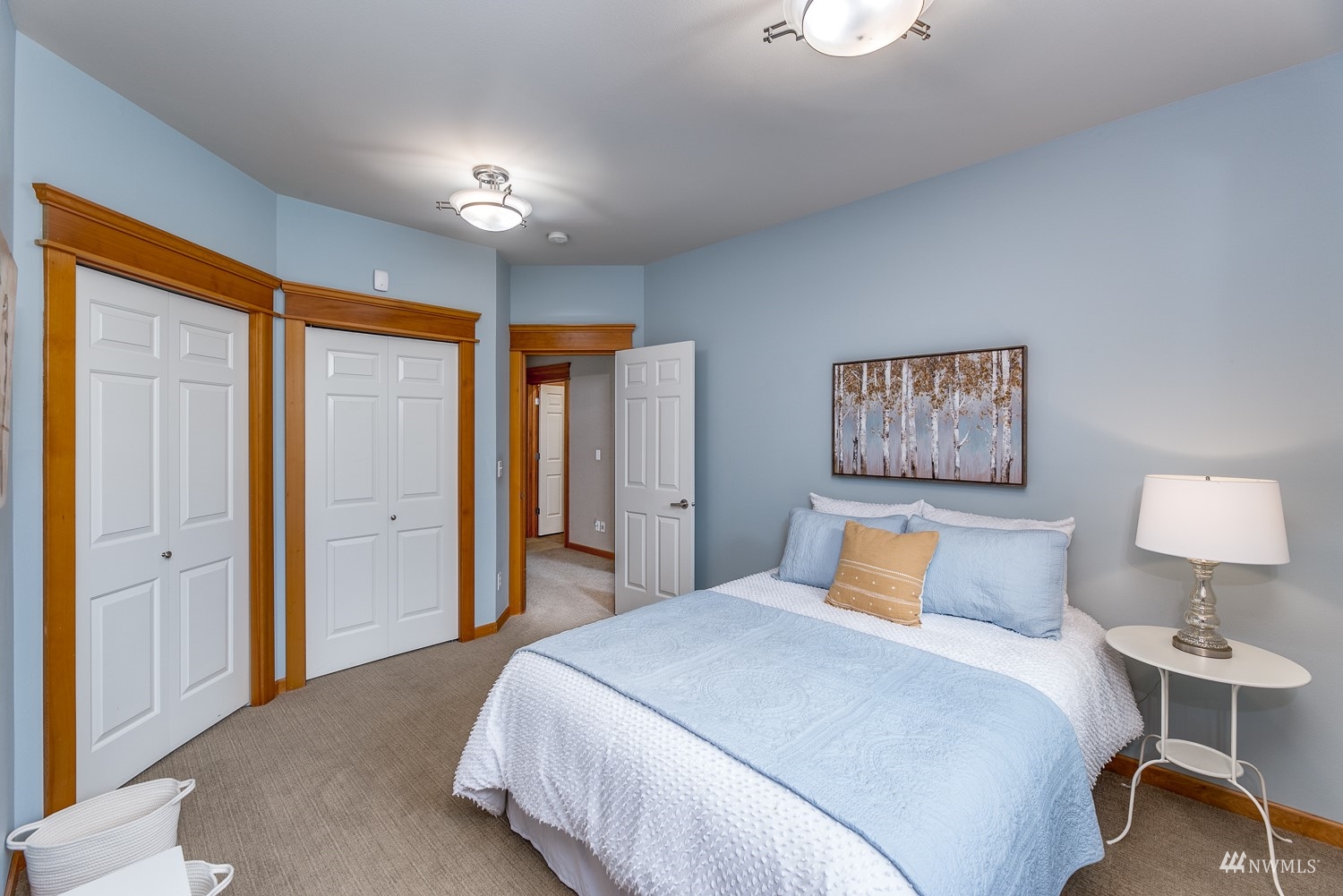 24222 23rd Avenue Southeast Bothell, WA 98021 - Photo 32 of 40 a bedroom with a large bed and a chandelier