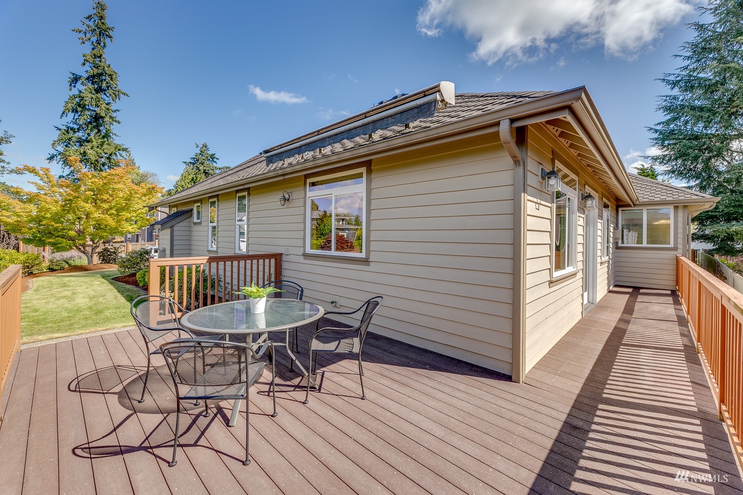 24222 23rd Avenue Southeast Bothell, WA 98021 - Photo 39 of 40 a backyard of a house with wooden floor outdoor seating and yard in backside