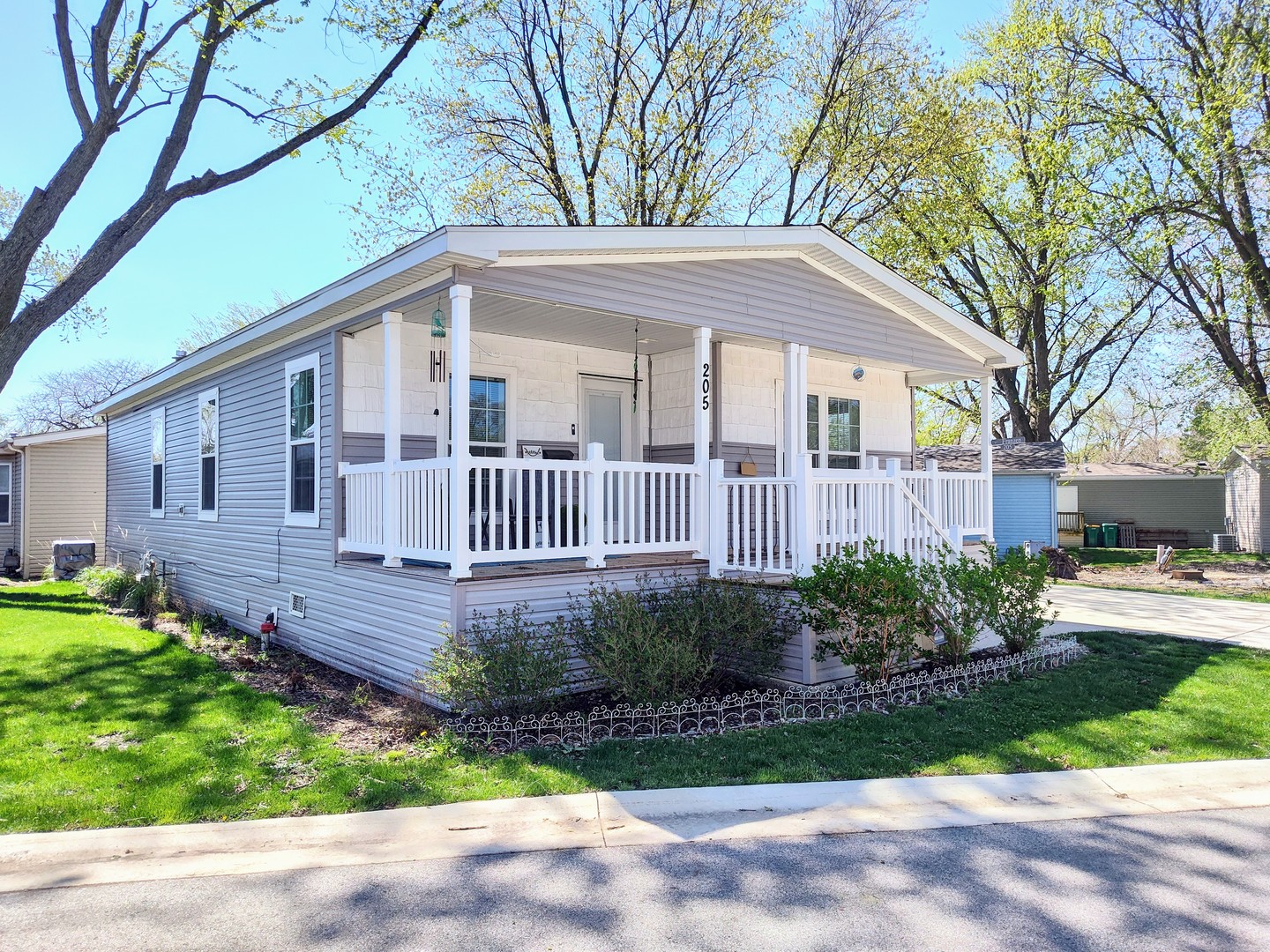 205 Tollview Road Elgin, IL 60123 - Photo 1 of 19 a view of a house with a yard and plants