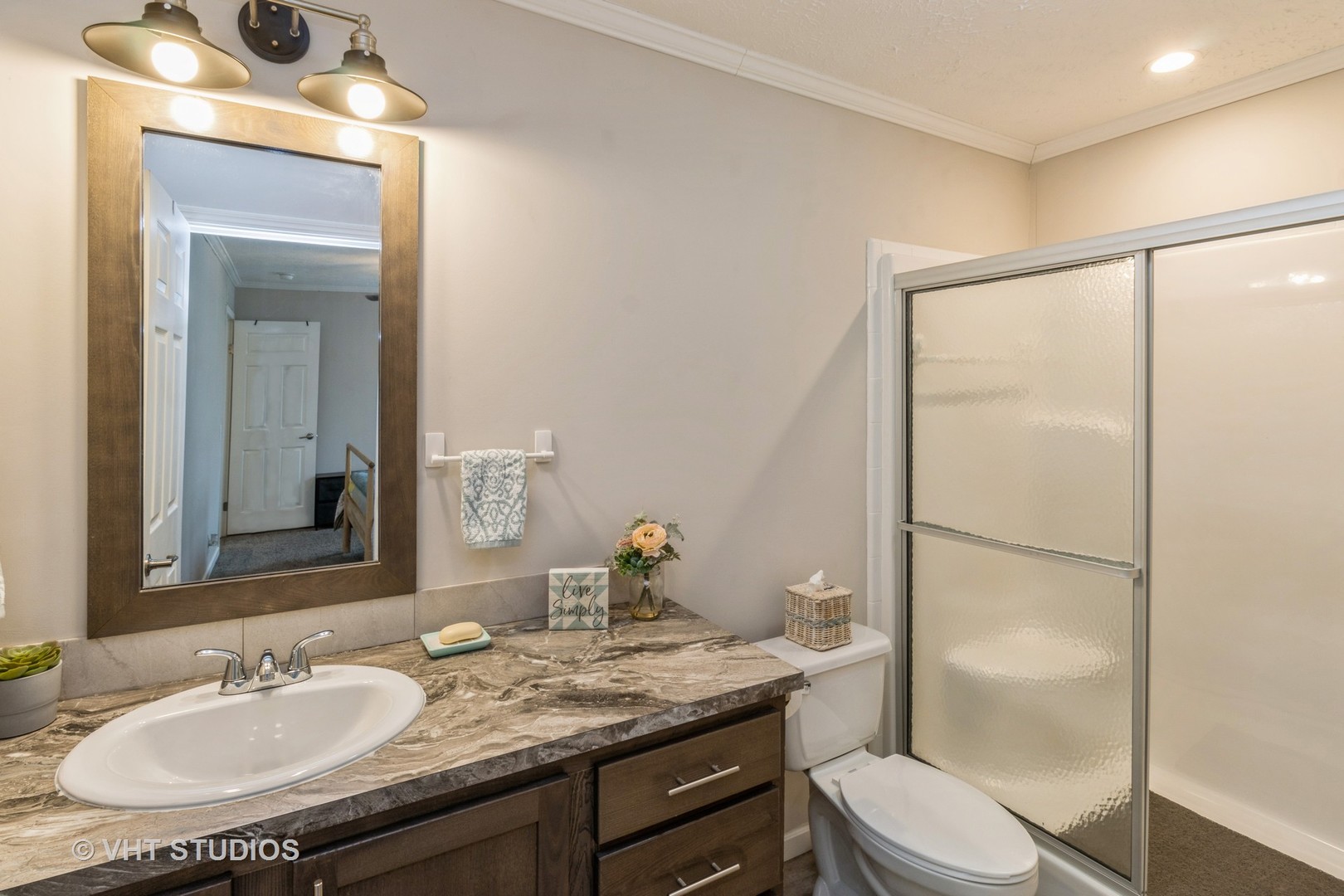 205 Tollview Road Elgin, IL 60123 - Photo 11 of 19 a bathroom with a granite countertop sink toilet a mirror and shower