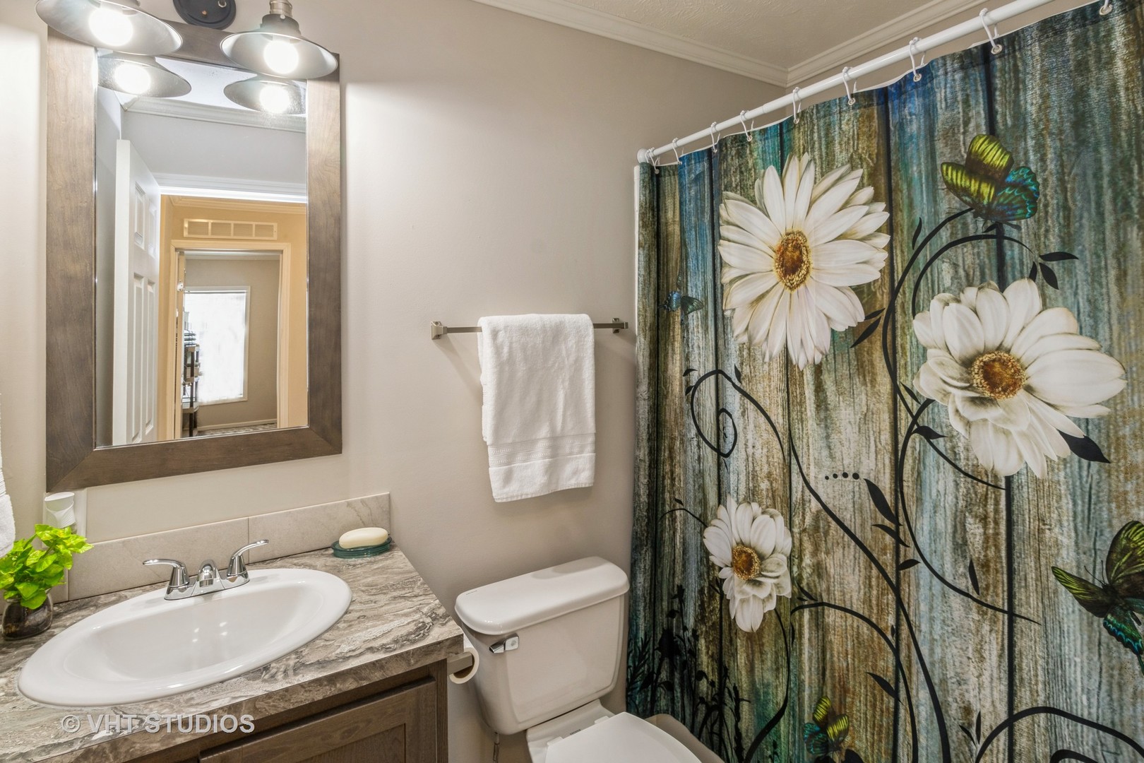 205 Tollview Road Elgin, IL 60123 - Photo 13 of 19 a bathroom with a toilet sink and mirror