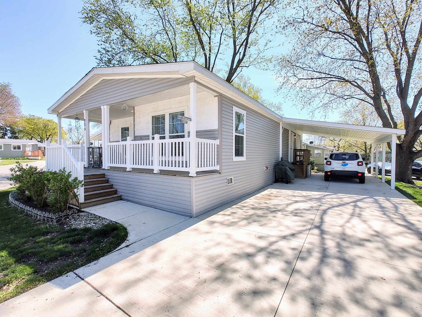 205 Tollview Road Elgin, IL 60123 - Photo 2 of 19 a front view of a house with a yard