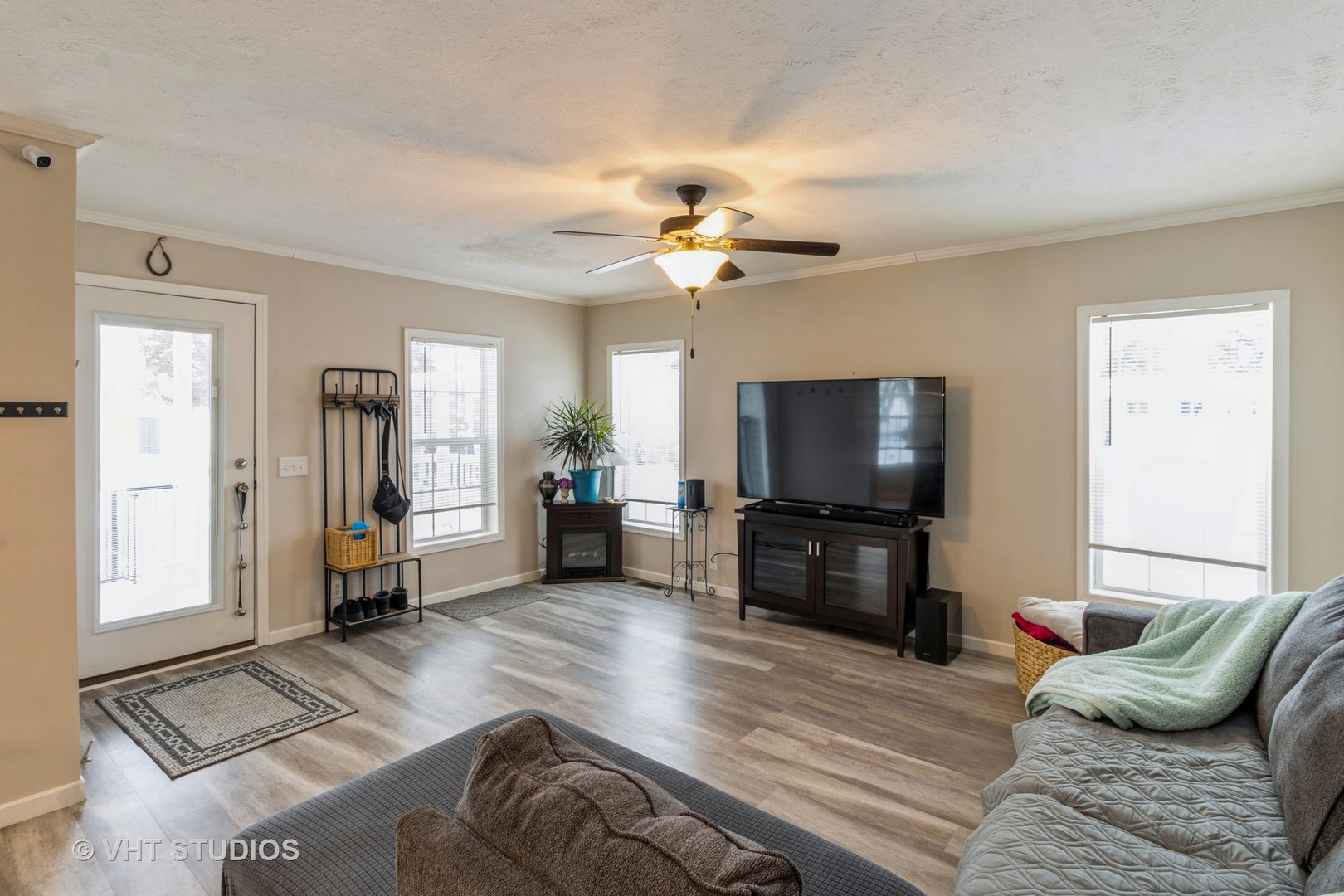 205 Tollview Road Elgin, IL 60123 - Photo 3 of 19 a living room with furniture and a flat screen tv