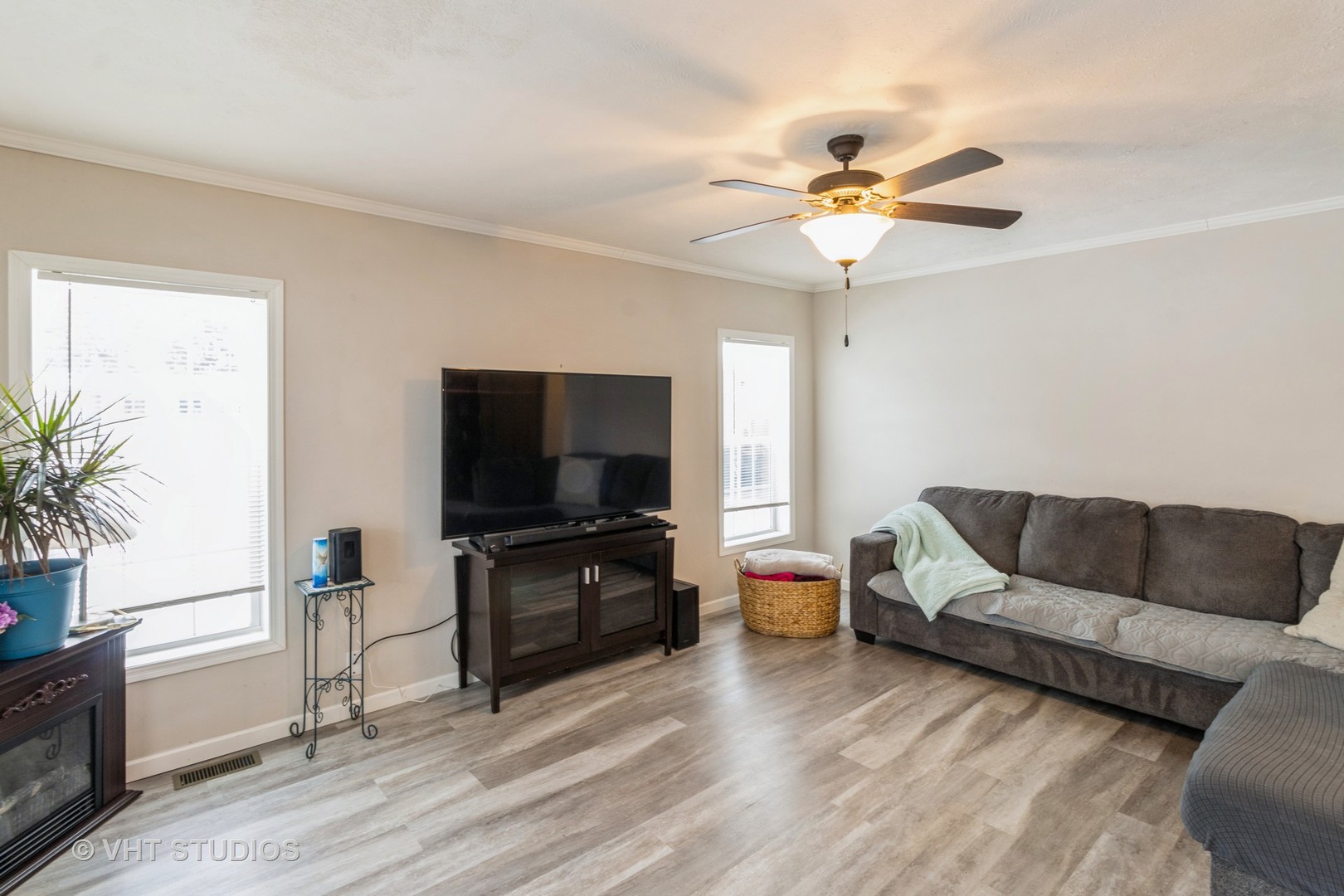 205 Tollview Road Elgin, IL 60123 - Photo 4 of 19 a living room with furniture and a flat screen tv