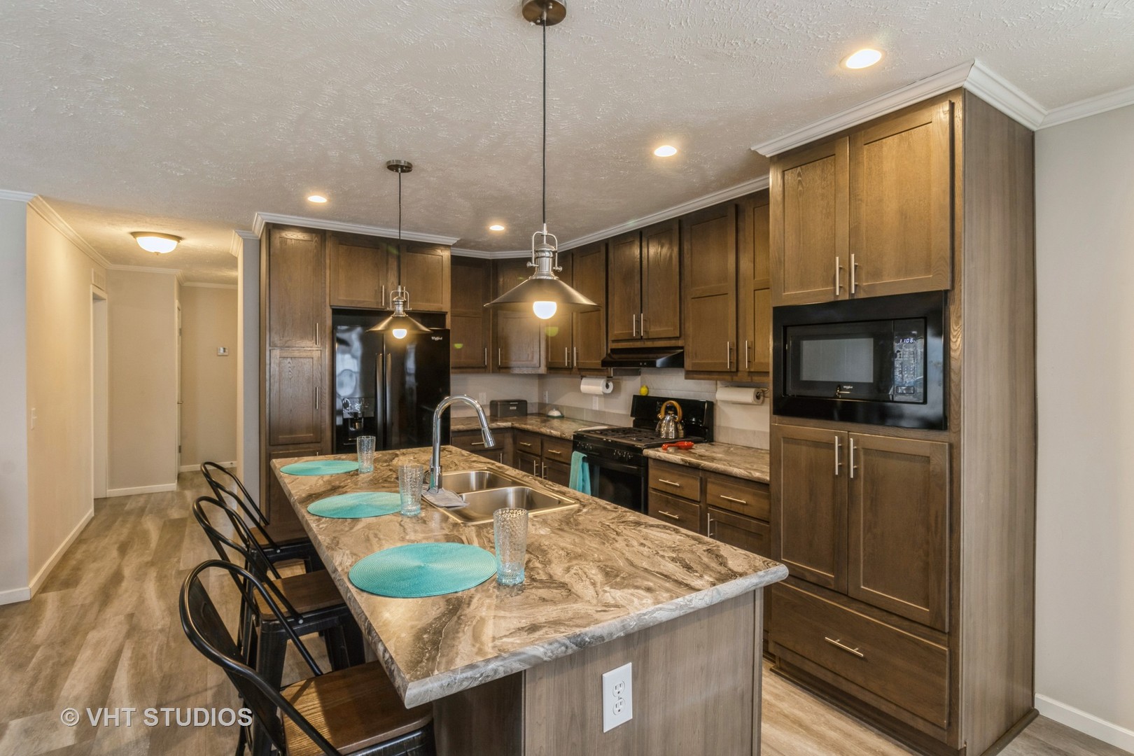 205 Tollview Road Elgin, IL 60123 - Photo 6 of 19 a kitchen with stainless steel appliances granite countertop a kitchen island a stove and a refrigerator