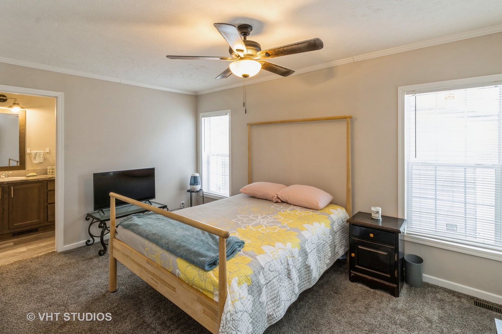 205 Tollview Road Elgin, IL 60123 - Photo 8 of 19 a bedroom with a bed and a chandelier