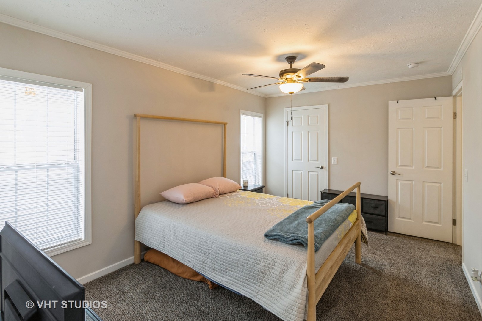 205 Tollview Road Elgin, IL 60123 - Photo 9 of 19 a bedroom with a bed and a chandelier