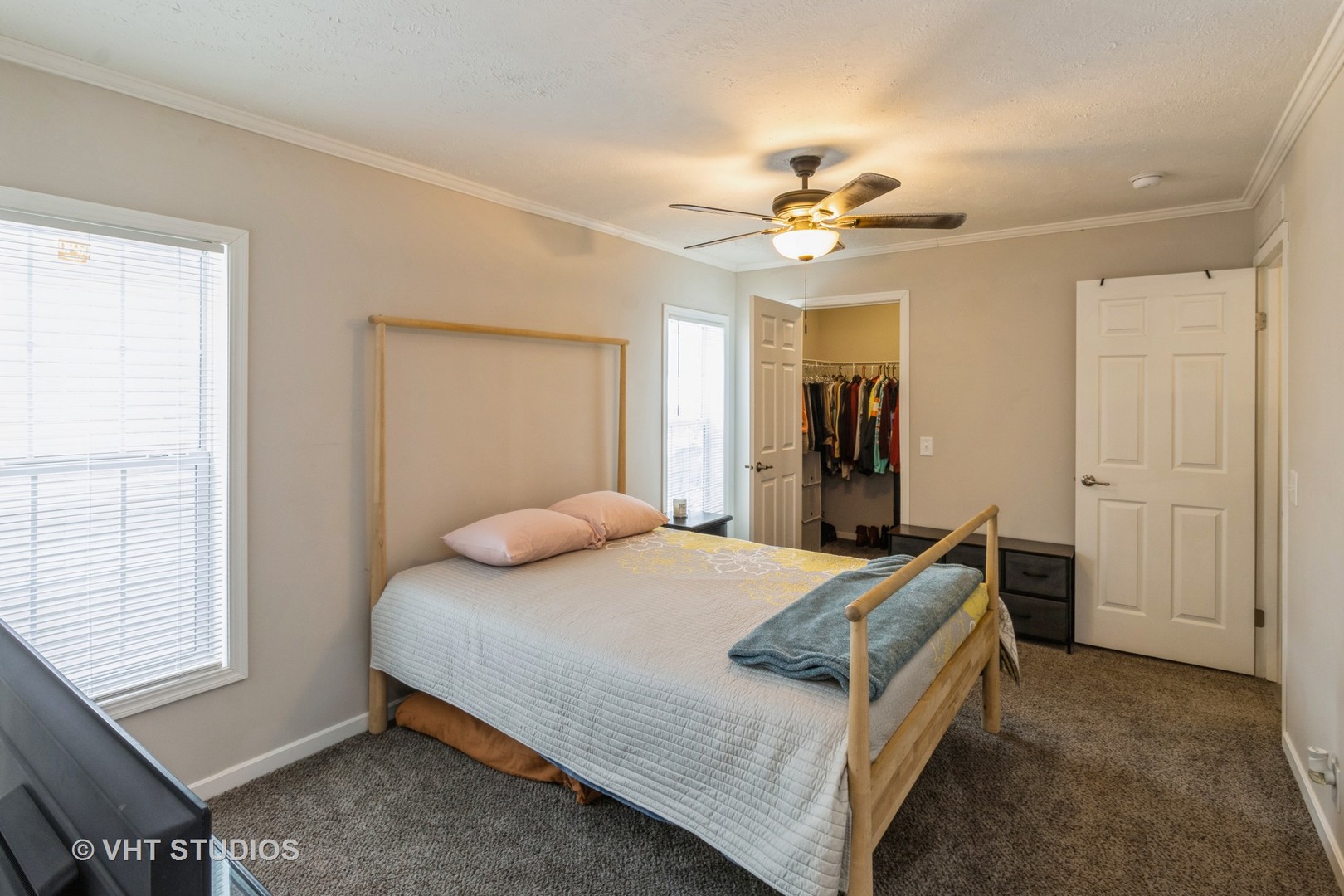 205 Tollview Road Elgin, IL 60123 - Photo 10 of 19 a bedroom with a bed and a chandelier