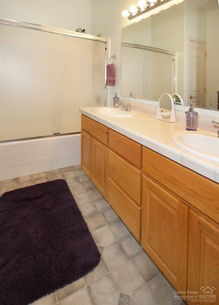 381 Southeast Soft Tail Loop Bend, OR 97702 - Photo 6 of 24 Guest Bath with dual vanity & linen