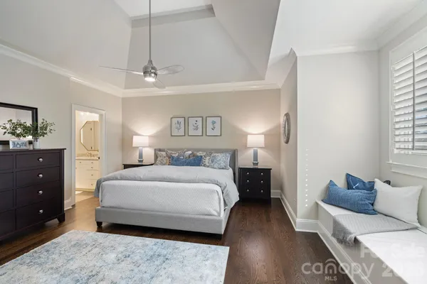 a living room with a bed and furniture