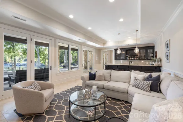 a living room with furniture and a large window