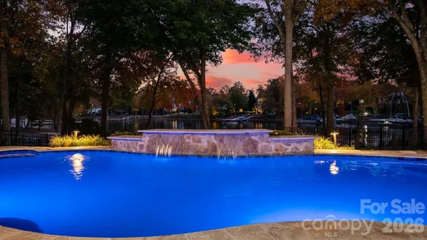 a view of a swimming pool with an outdoor space and seating area