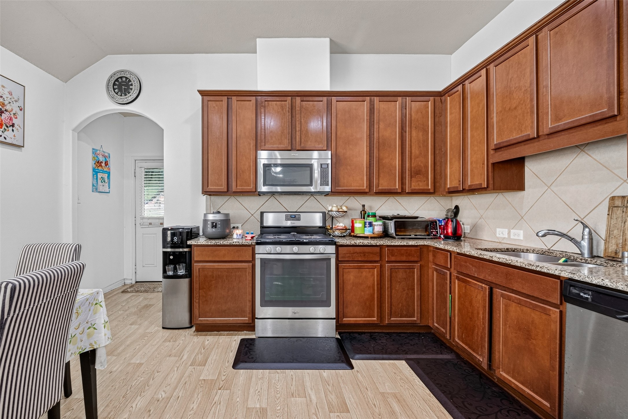 9314 Fuqua Ridge Lane Houston, TX 77075 - Photo 11 of 24 a kitchen with stainless steel appliances granite countertop a stove sink and cabinets