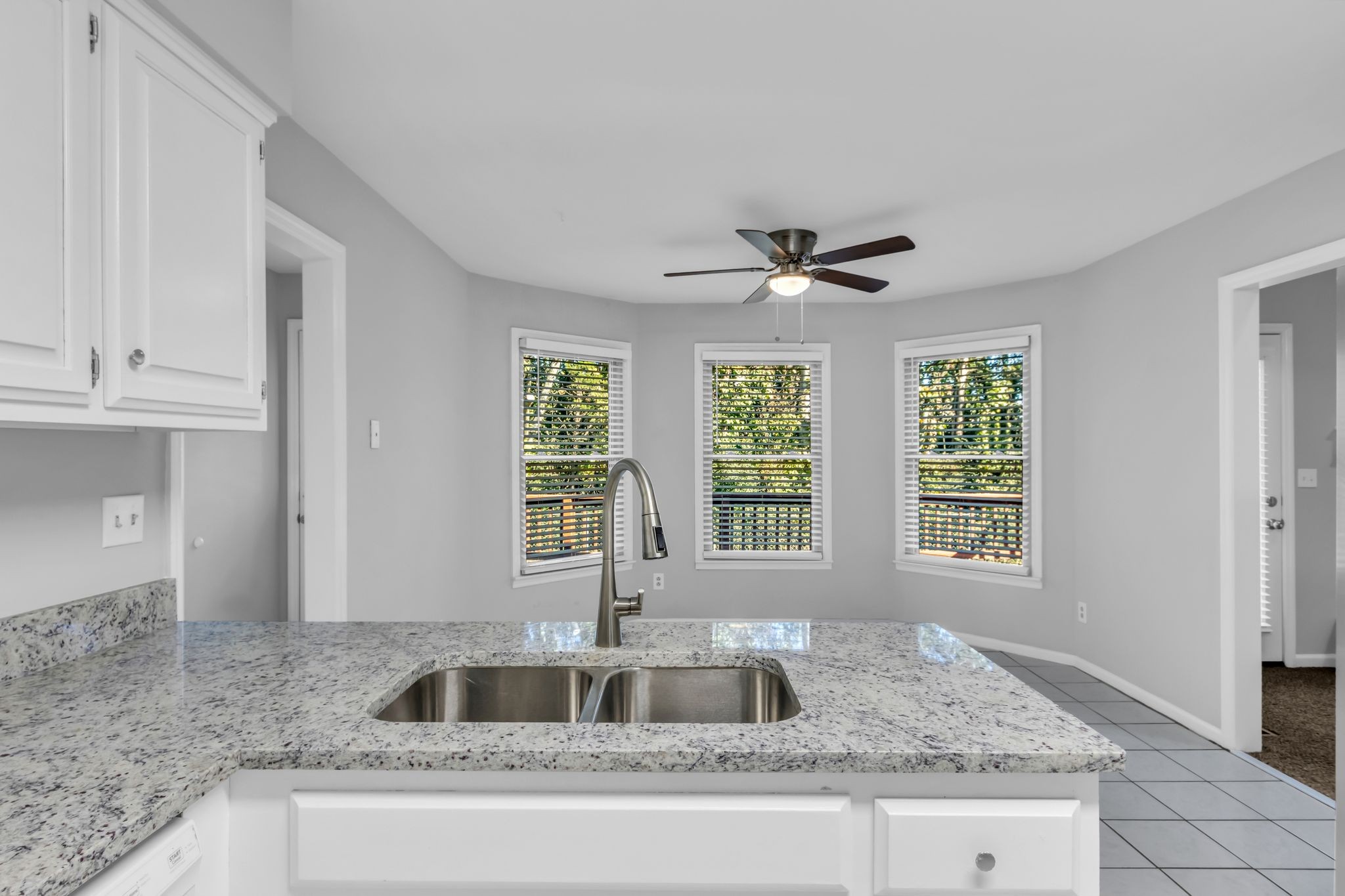 2560 Choctaw Trace Murfreesboro, TN 37129 - Photo 12 of 36 a kitchen with granite countertop a sink and a large window