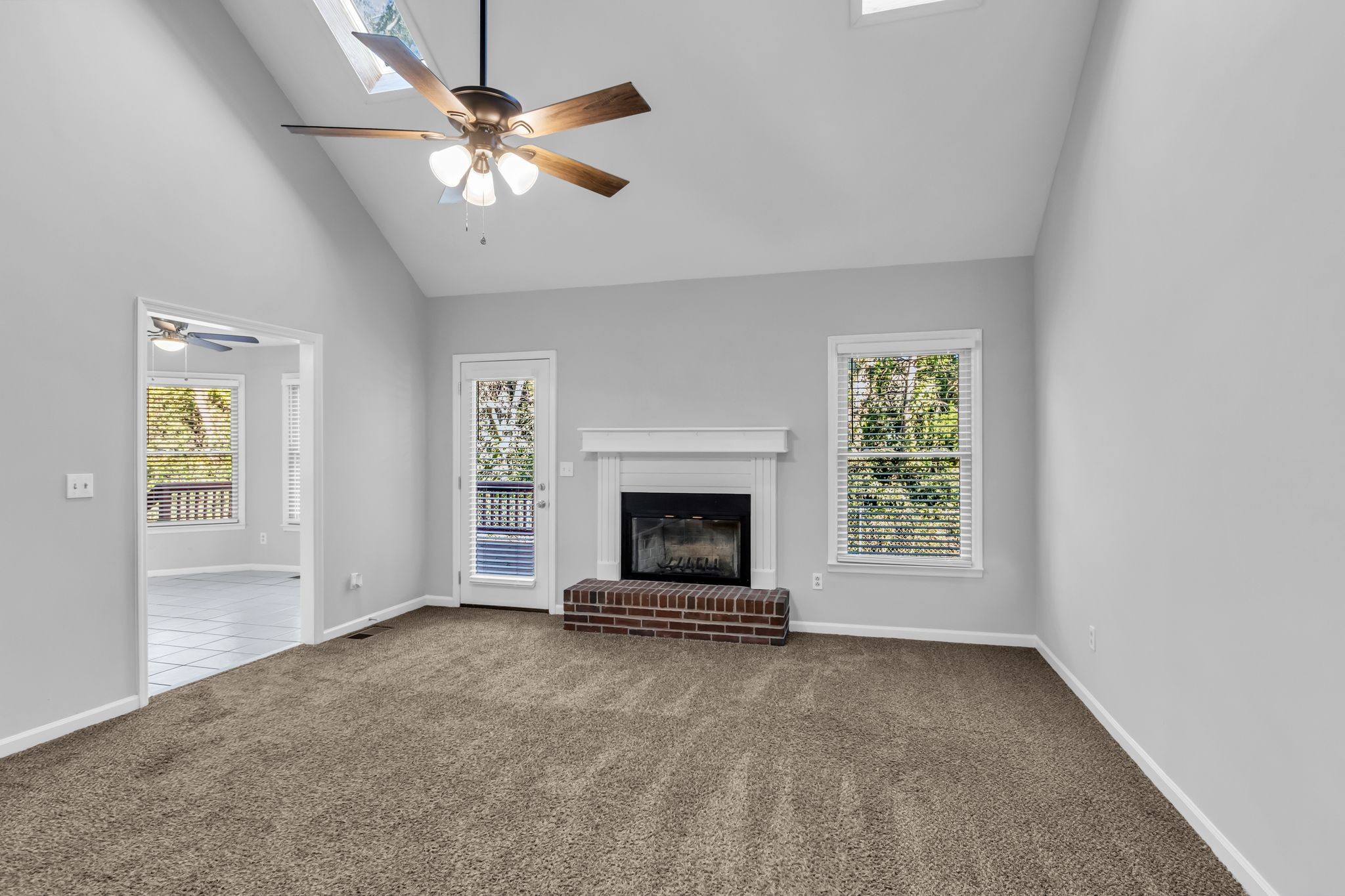 2560 Choctaw Trace Murfreesboro, TN 37129 - Photo 18 of 36 an empty room with fireplace and windows