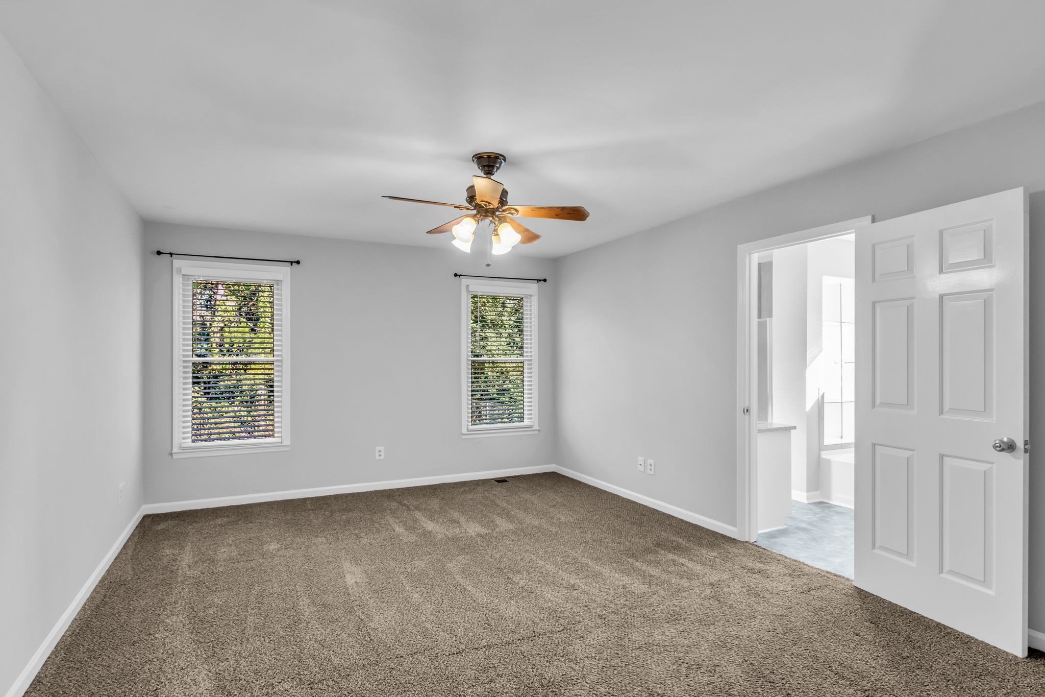 2560 Choctaw Trace Murfreesboro, TN 37129 - Photo 19 of 36 an empty room with windows and chandelier fan