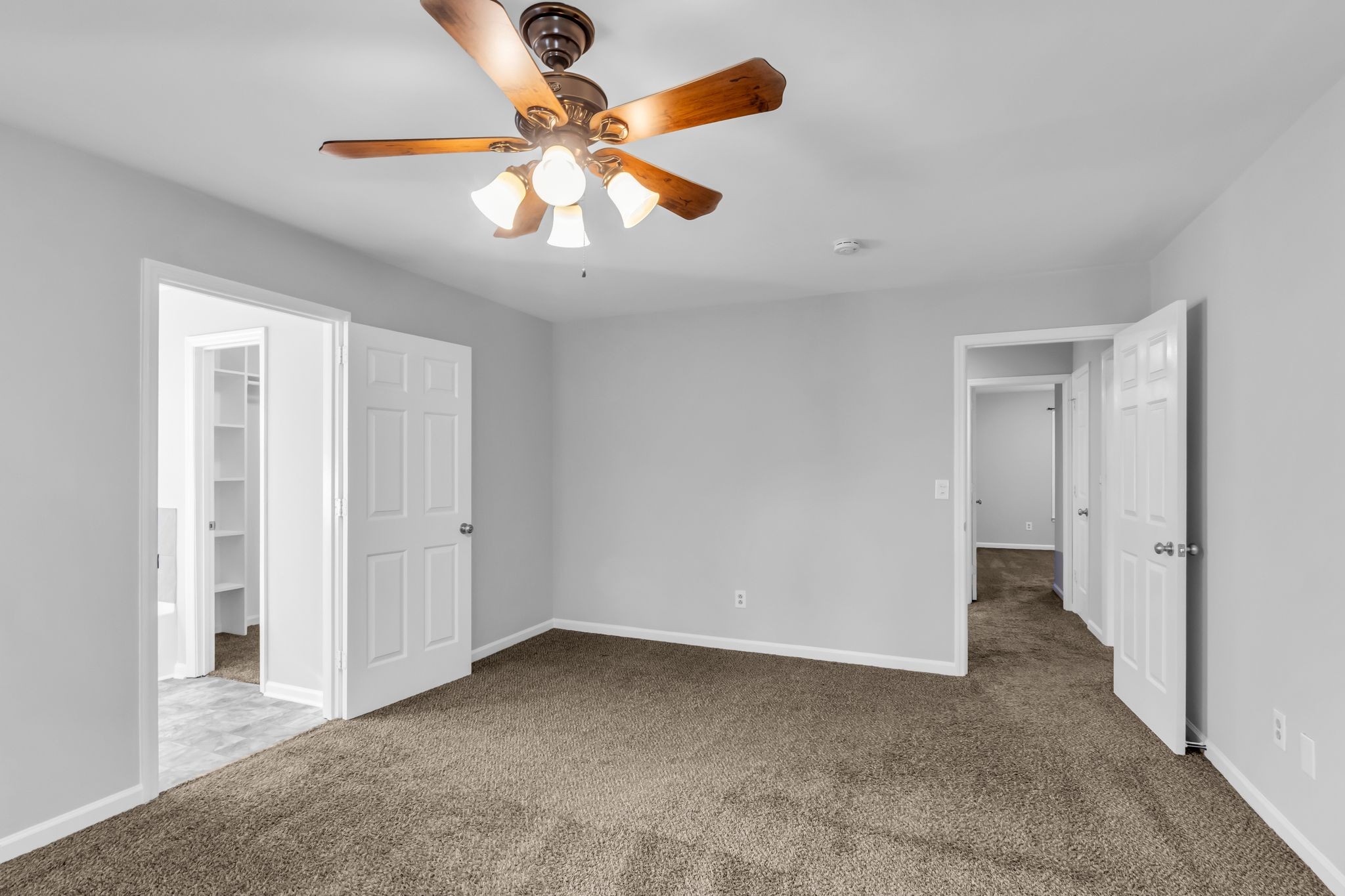 2560 Choctaw Trace Murfreesboro, TN 37129 - Photo 21 of 36 an empty room with a chandelier fan and a ceiling fan