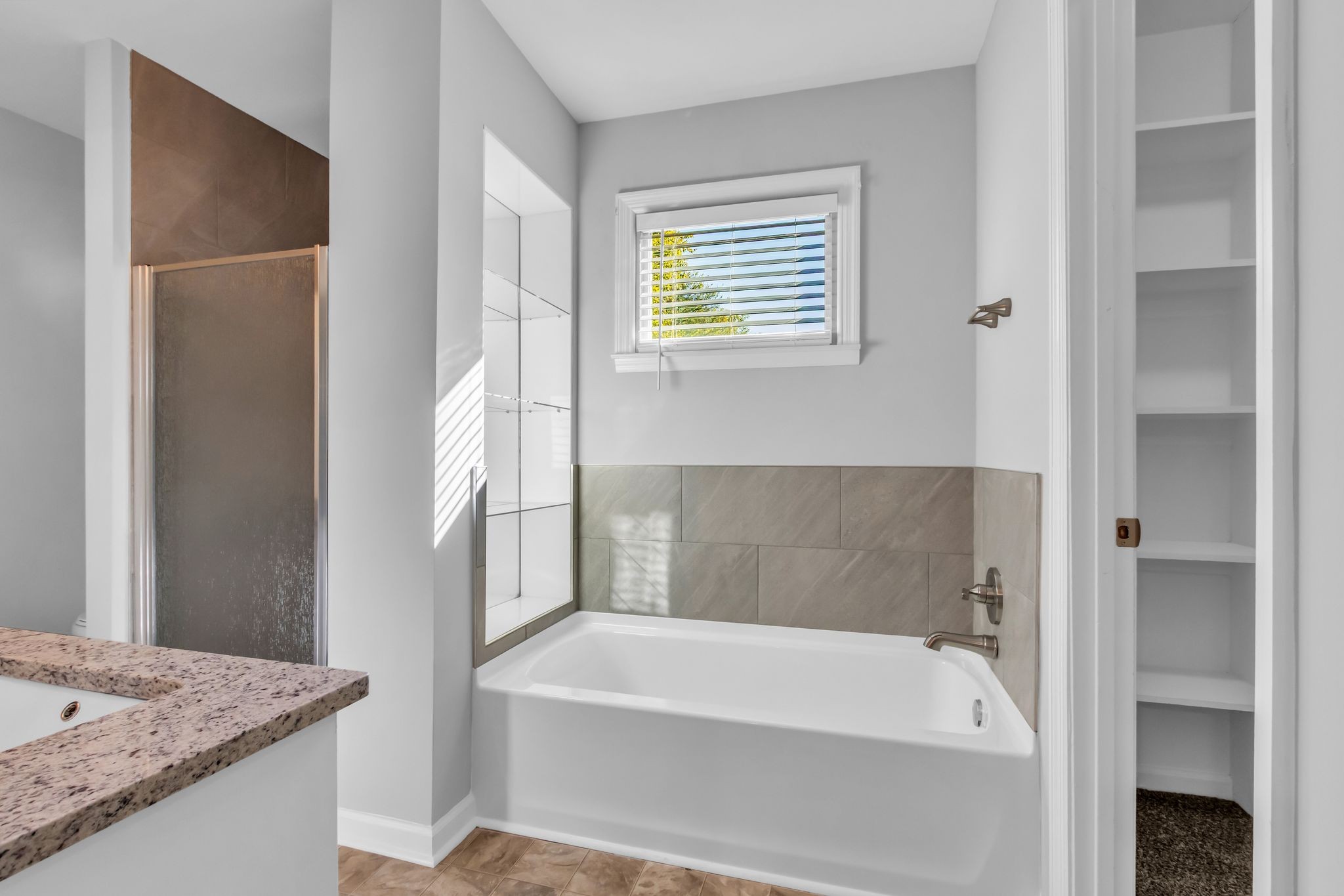 2560 Choctaw Trace Murfreesboro, TN 37129 - Photo 22 of 36 a bathroom with a bathtub and a sink